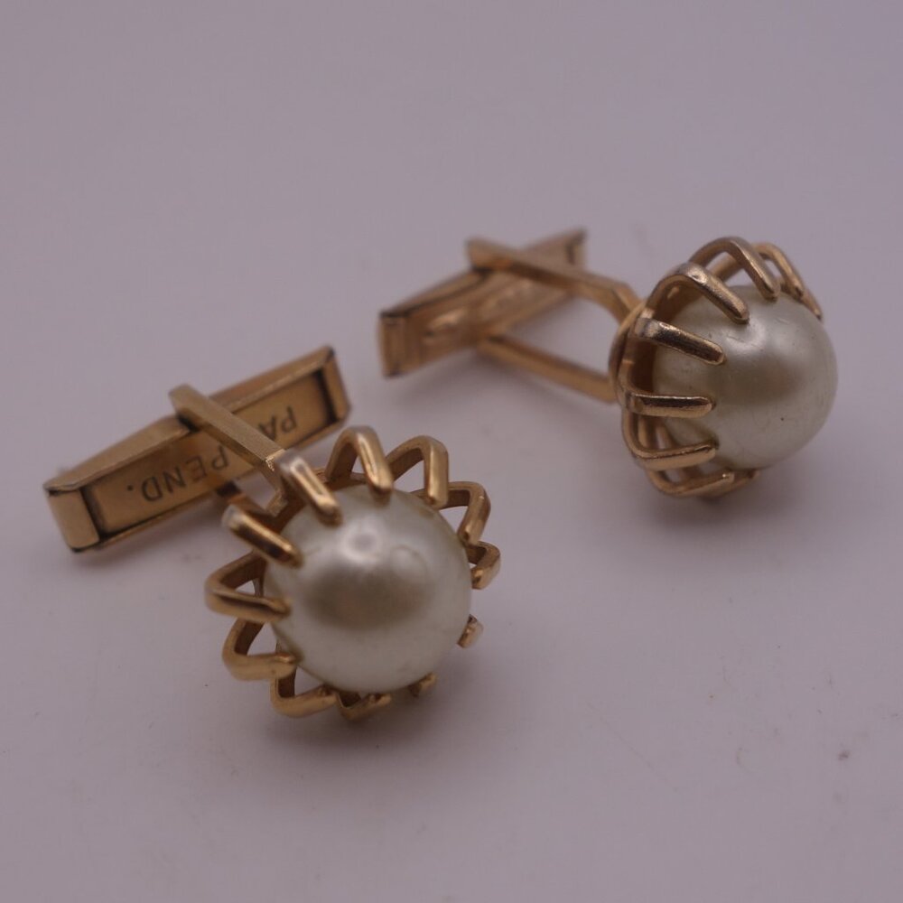 Gold Color Cuff Links with Setting Holding a Pearl PAT. PEND